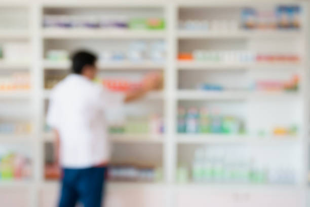 istock blur pharmacist taking medicine from shelf in the pharmacy 840333398