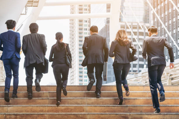 istock Group of Business People Running in Row 840334370