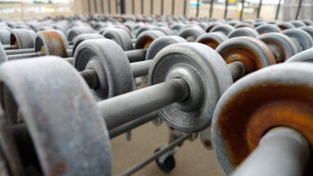 istock Retro Rusted Roller Conveyor tracks. Rows of wheels and bars. ver3 840336614