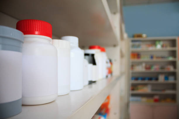 istock medicine bottles arranged on shelf at drugstore 840340298