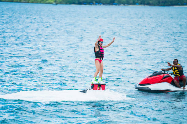 istock Woman challenging flyboard in guam resort 840349482