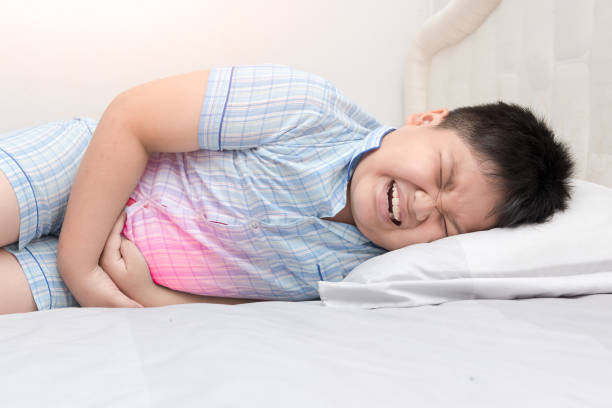 istock asian fat child suffering from stomachache 840364418