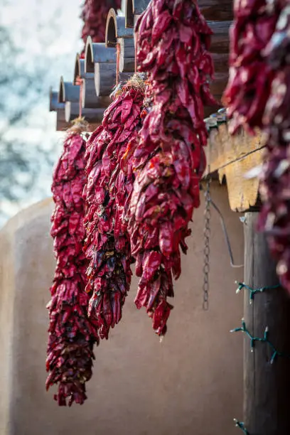 Red chile ristras is hanged by a window in Alberqueque, New Mexico