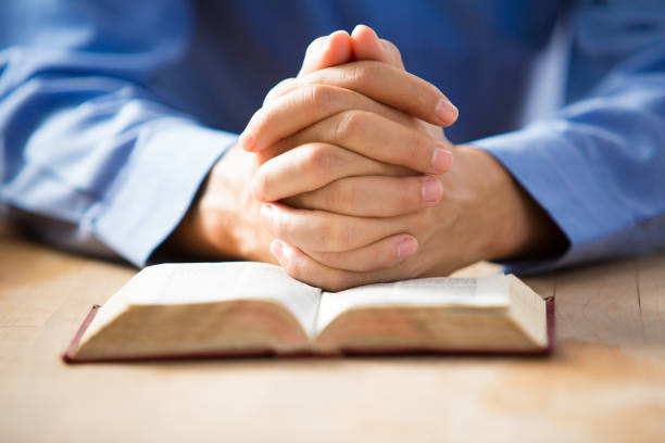 istock A man reading the Holy Bible. 840373054