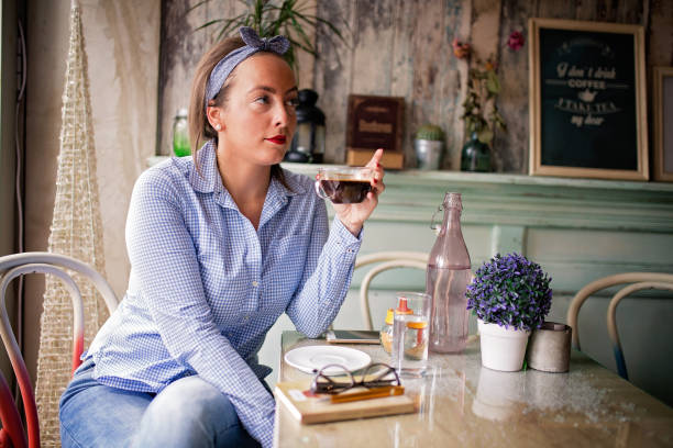 istock Young woman in a cafe 840373522