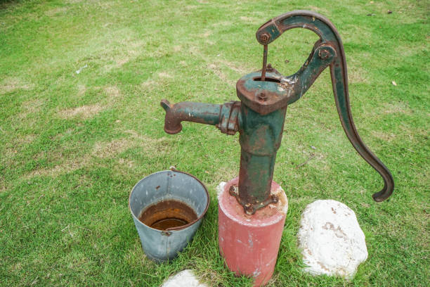 istock old and rusty vintage water pump with stainless bucket 840376106