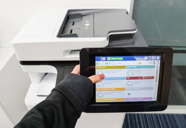 istock women wearing black jacket use office printer by touch screen for copying documents 840376152
