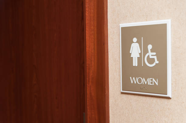 istock Women restroom sign close up 840376240