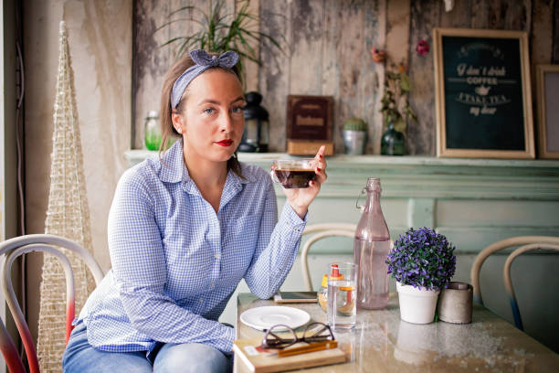 istock Young woman in a cafe 840382144