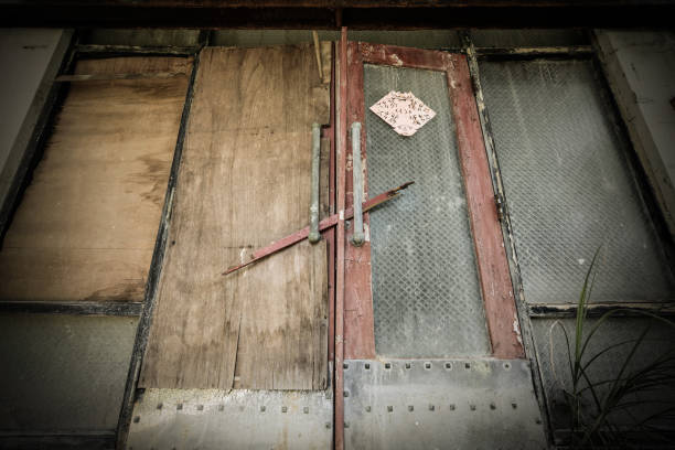 Metal objects hanging on nail at workshop