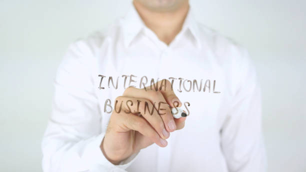 istock International Business, Man Writing on Glass 840391726