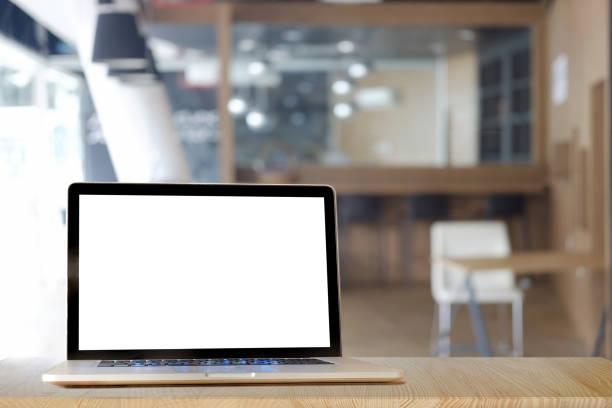 istock Mock up Blank screen of Laptop on marble table in Co-working or cafe. 840392702