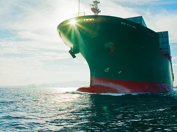Sun shining through bow of cargo ship  ships bow photos stock pictures, royalty-free photos & images