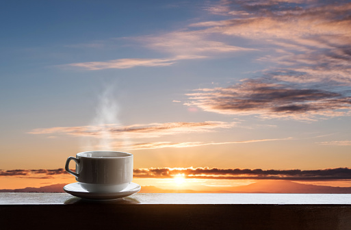 Morning hot coffee in sunrise