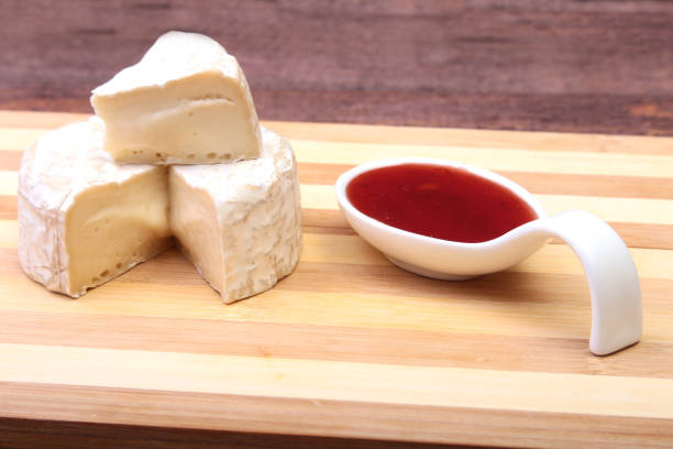 istock Cheese with white mold. Camembert or brie type with Cranberry sauce.. Healthy breakfast. 840399756