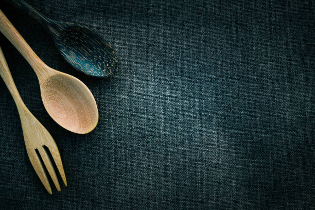 istock Wooden spoon on table cloth background. 840399986
