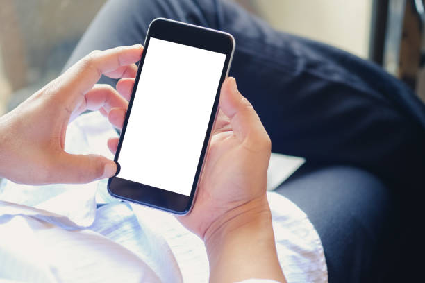 istock Business man using smartphone in office. Blank screen mobile phone for graphic display montage. 840401328