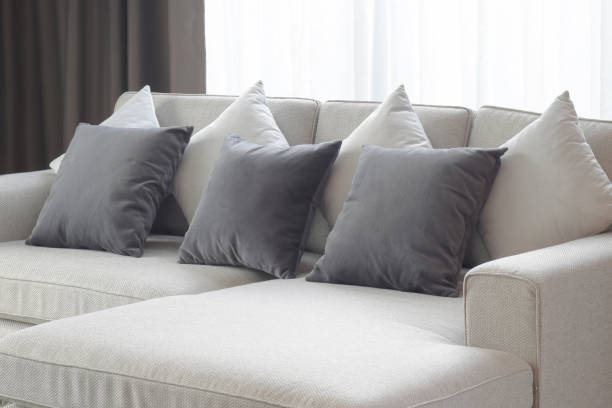 istock Two tone pillows lay on beige sofa in living room 840404640