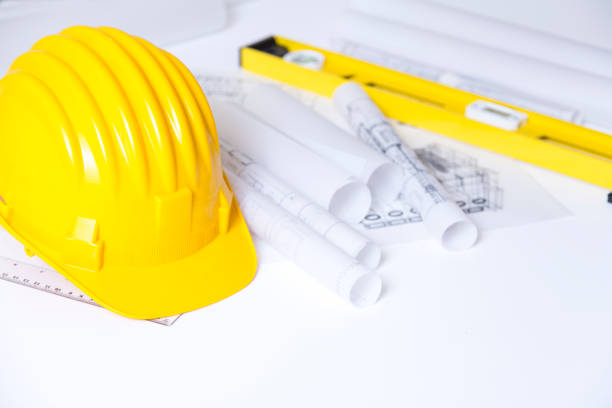 istock Yellow safety helmet and plan drawing 840407796