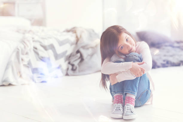 istock Charming adorable child sitting in her room 840412464