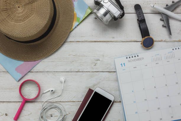 istock Flat lay of planing travel with technology background concept.Essential several items on the modern white rustic wood office desk.Object prepare for teenage or adult and travel to trip holidays. 840413074