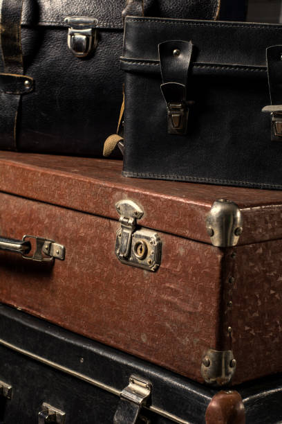 istock Close-up of a stack vintage shabby suitcases 840415988