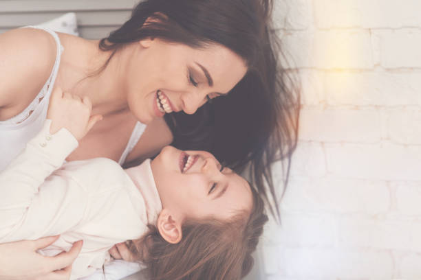 istock Adorable child and her mom sharing a happy moment 840416726
