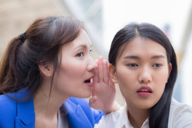 istock Two girl gossip about secret and feeling so surprise 840420128