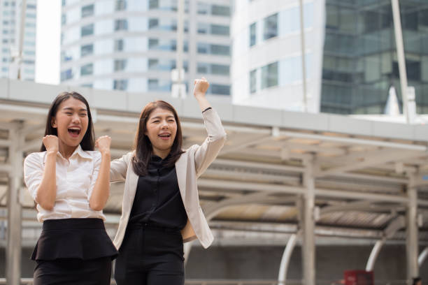 istock Two business woman celebrating 840420706