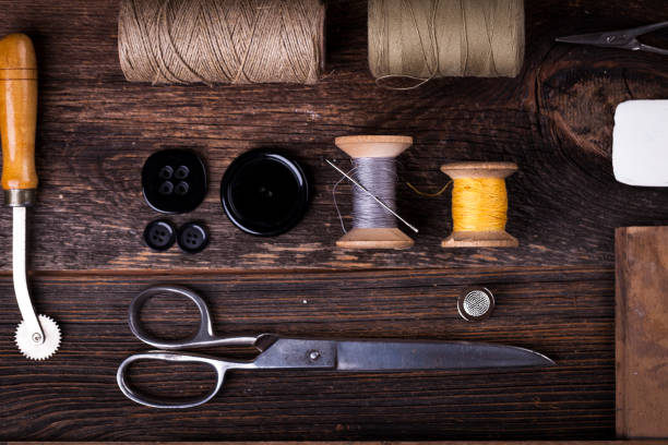 istock Sewing tools on wooden table in vintage style 840421062