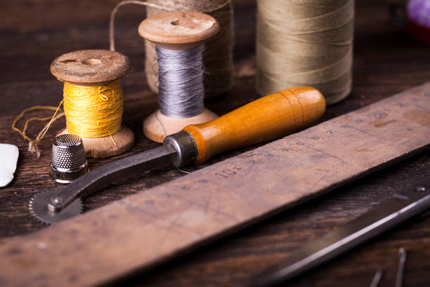 istock Sewing tools on wooden table in vintage style 840421080