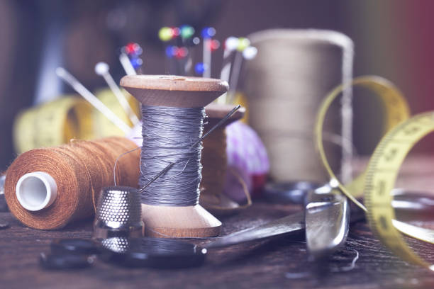 istock Sewing tools on wooden table in vintage style 840421092