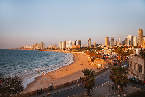 Tel Aviv, Israel - October 30th, 2016: people swimming by the Tel Aviv beach in the afternoon in Tel Aviv, Israel.