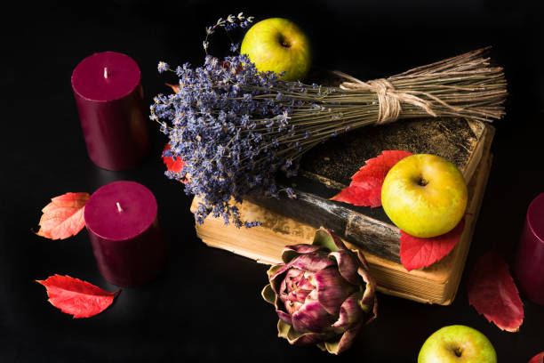 istock Romantic and mysterious fall composition with books and candles 840424458