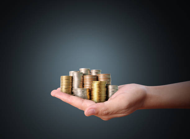 istock Hand human hand putting coin to money 840427514