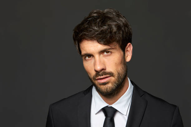 istock Portrait of professional against black background 840428114