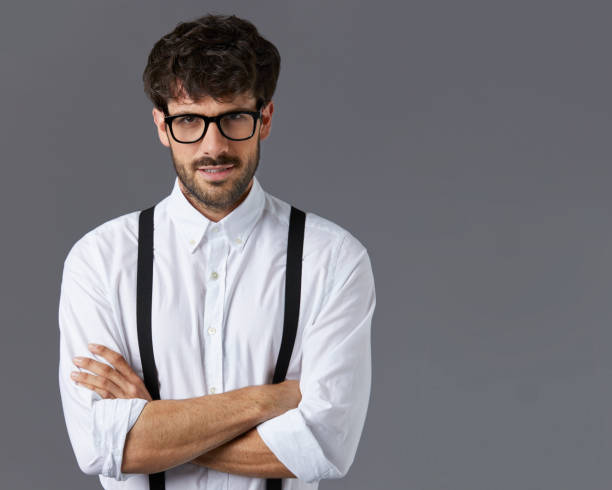istock Confident businessman standing with arms crossed 840428348