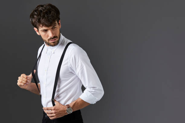 istock Serious businessman holding suspenders 840428424