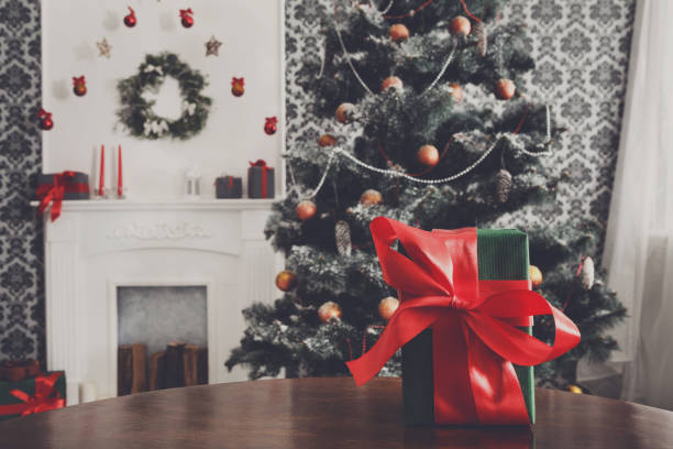 istock Christmas present in decorated room background, holiday concept 840428506