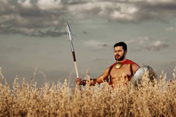 istock Muscular medieval warrior standing in the field 840439332
