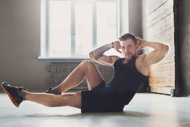 istock Young man fitness workout, cross crunches for abs 840443480