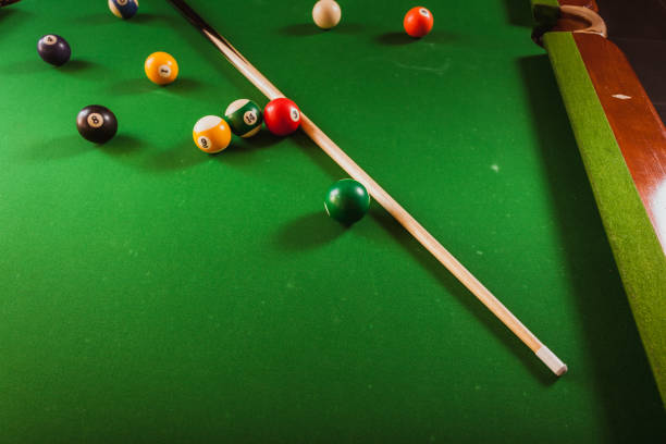 istock Snooker ball and stick on billiard table 840444562