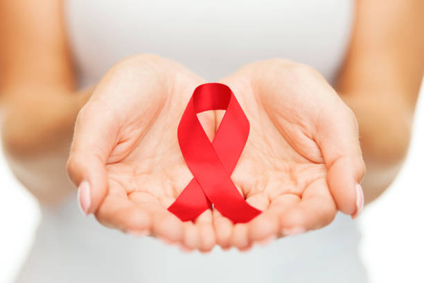 istock hands holding red AIDS awareness ribbon 840449008