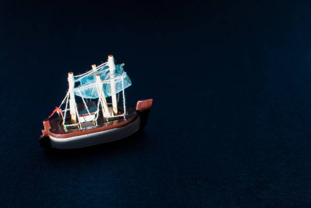 istock Woody boat model on a blue background 840457450