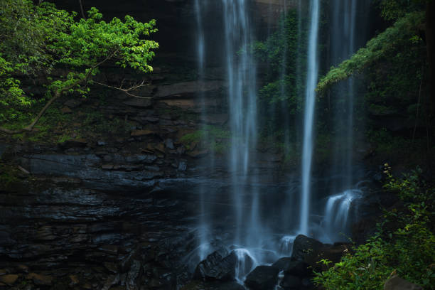 istock Waterfall impact on black stone at the jungle 840457710