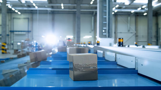 istock Parcels are Moving on Belt Conveyor at Post Sorting Office. Box POV. 840457974