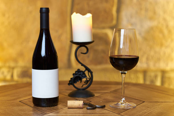 istock Wine bottle with glass and candle 840458188
