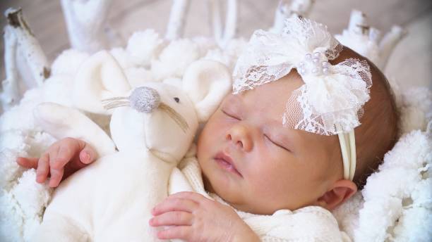 istock Little Newborn Baby Sleeping in Studio 840459042