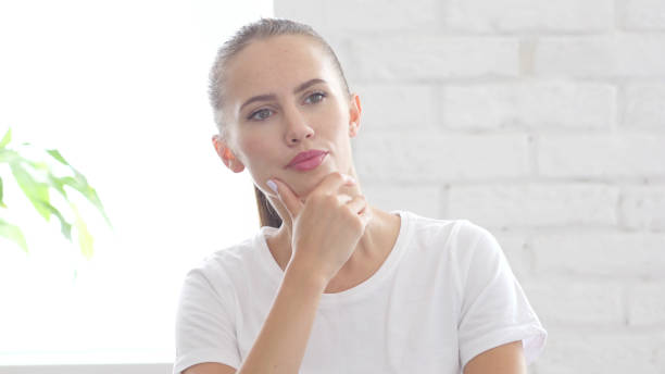 istock Pensive Young Woman Thinking about Work, Brainstorming, Portrait 840461404