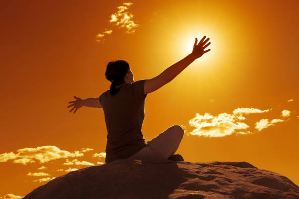 istock woman stretching arms at sunset 840465462
